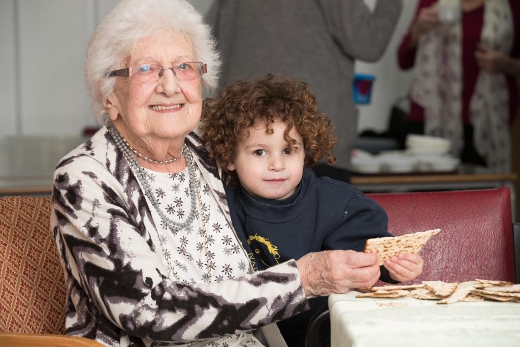 Hilda Sharpe, 101, with great grandson Seth at Jewish Care's mock Seder